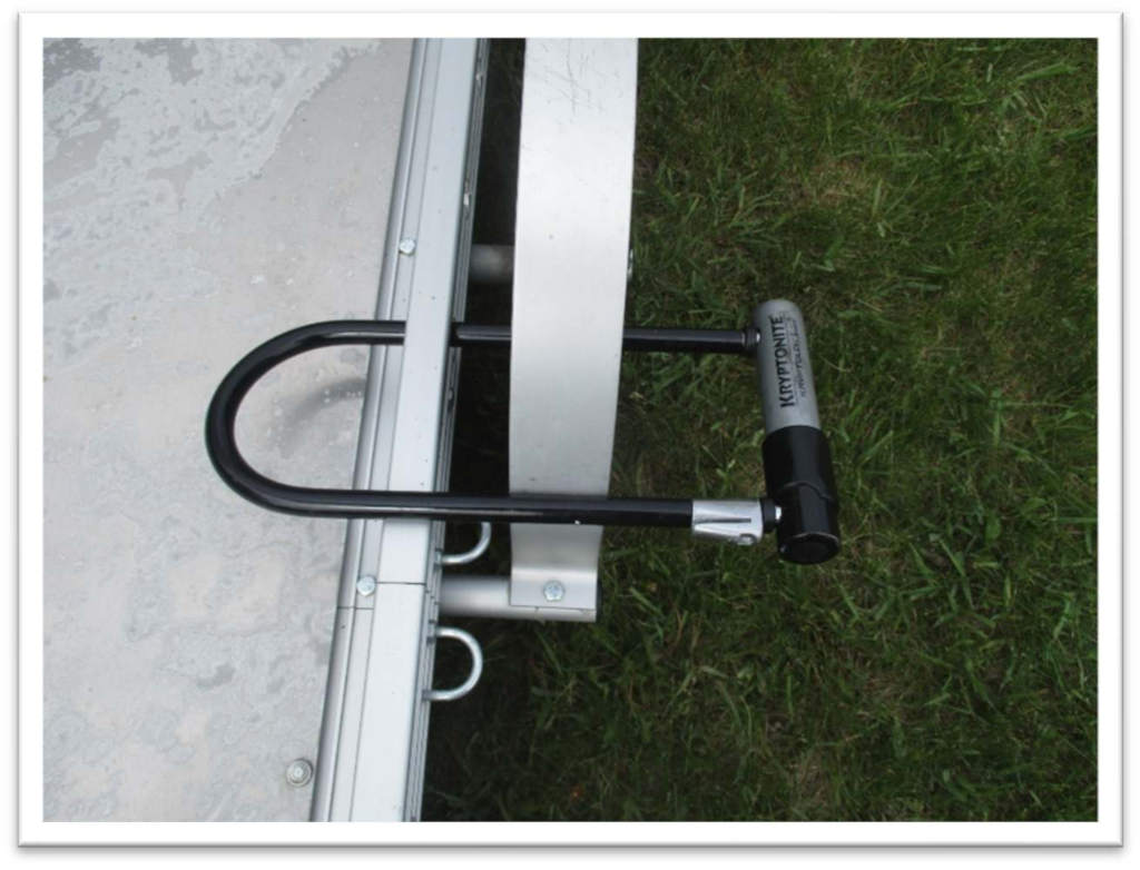 U-lock through wheel and frame of trailer