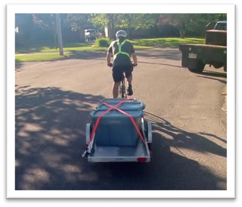 Dave pulling the trailer with his bike