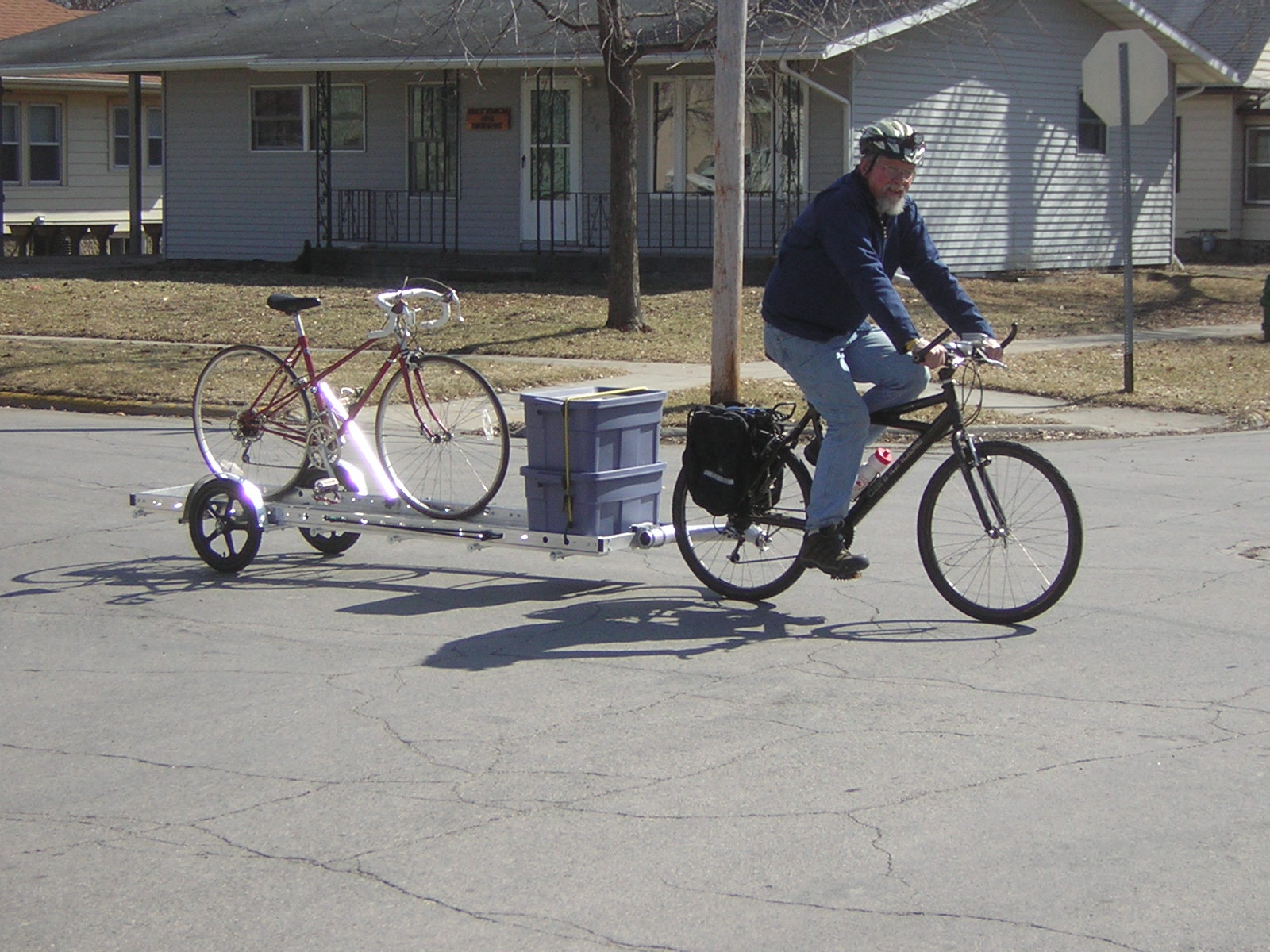 Bicycle Repair Man Craig Corson carrying a bike and his tools on a 96A trailer