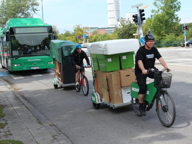 Move by Bike hauling a load on their 64AWD trailers